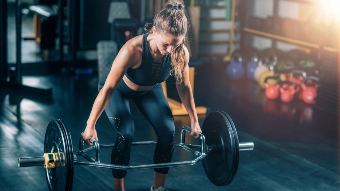 Woman using bar path for deadlifts
