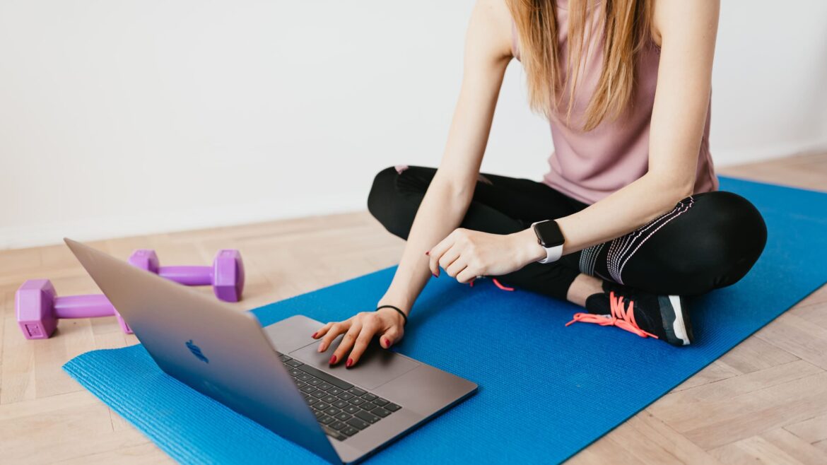Woman using laptop for journaling
